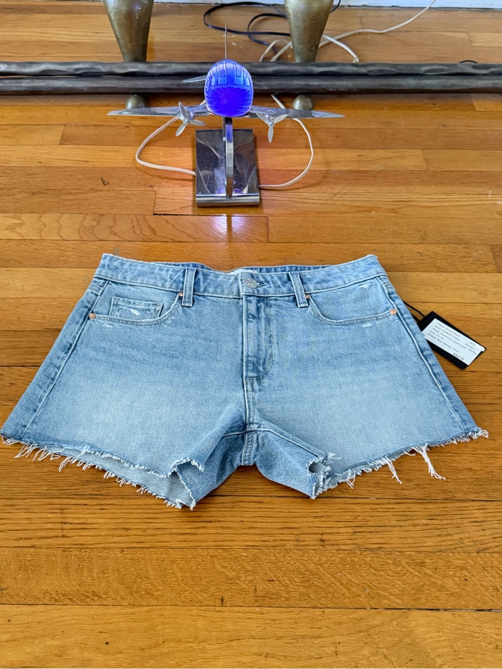 PAIGE Light Blue Denim Cutoff Shorts with Frayed Hem